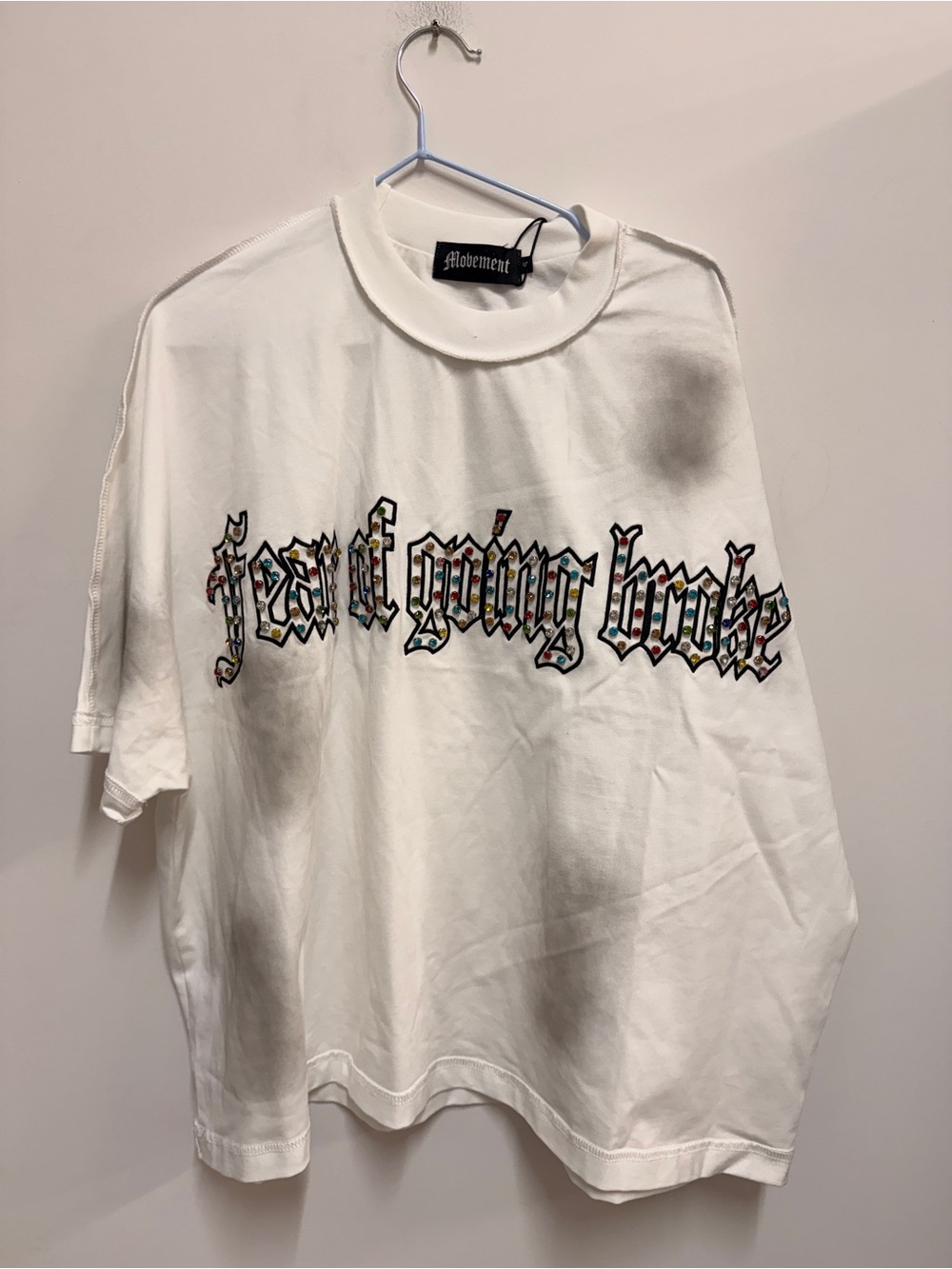 Movement White Short Sleeve Graphic Tee - 'Feast Going Broke'